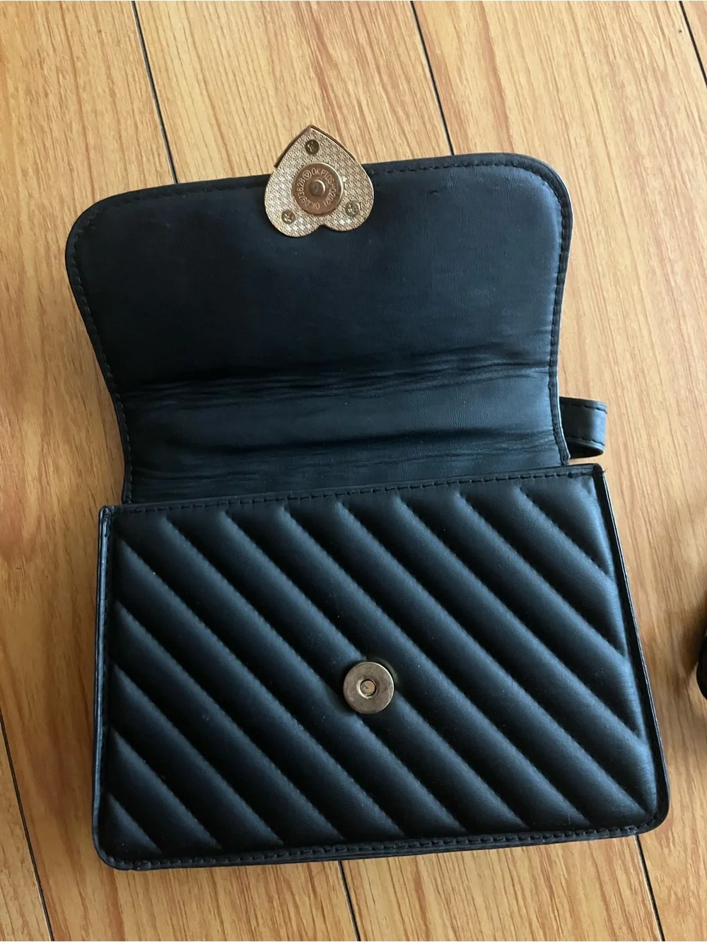 Black Quilted Shoulder Bag with Gold Heart Accent